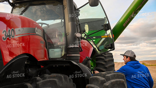 Farmer Climbing into Tractor Cab 25759