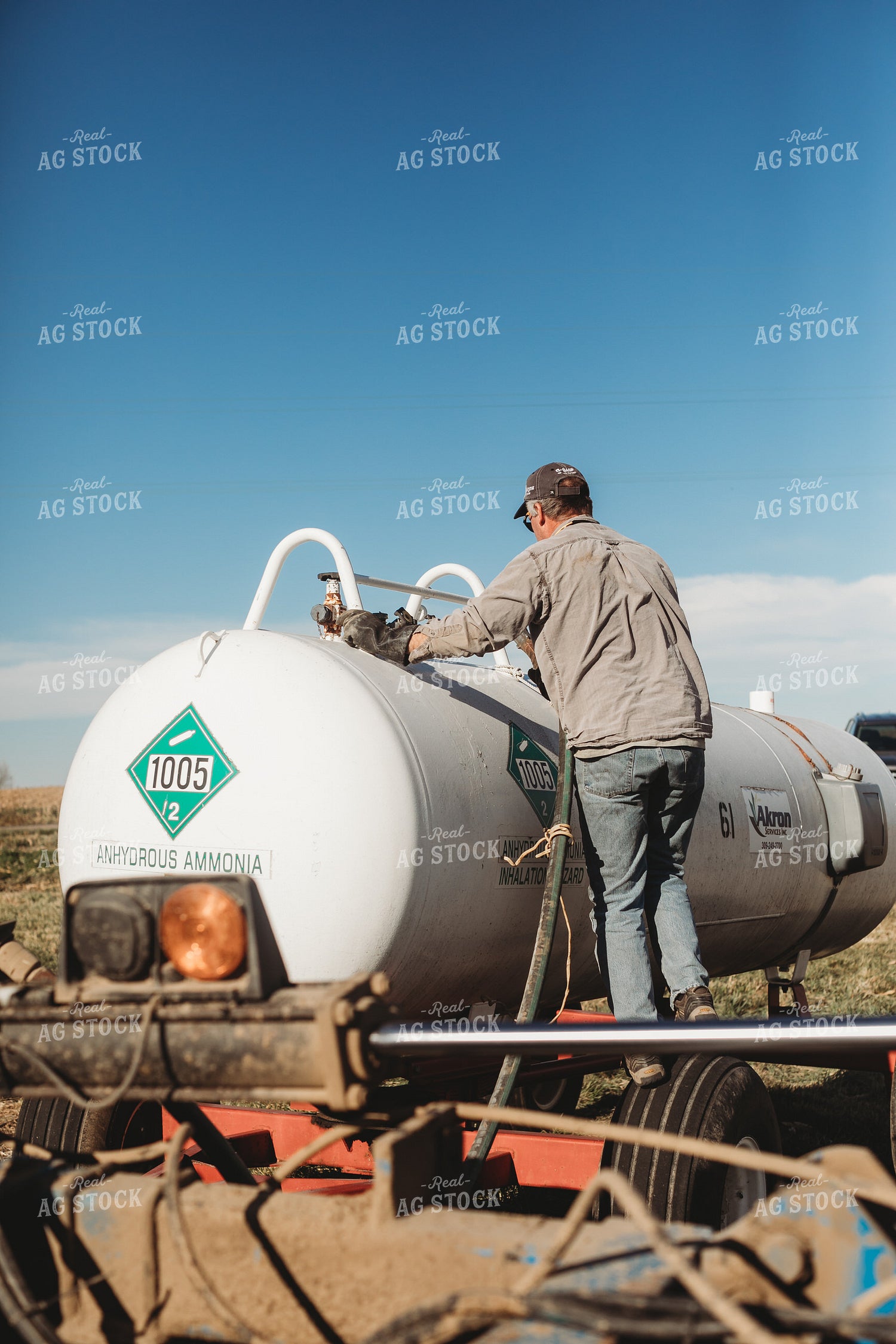 Farmer Hooking Up Anhydrous Ammonia Tank 3569
