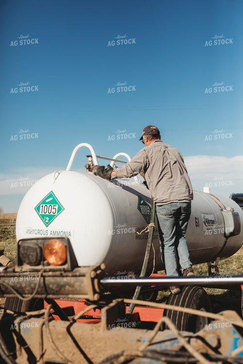 Farmer Hooking Up Anhydrous Ammonia Tank 3569