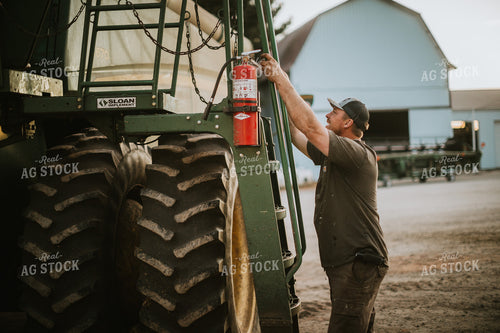 Farmer Working on Combine 5128