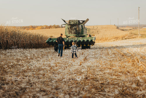 Farmer and Son Getting into Combine 9480