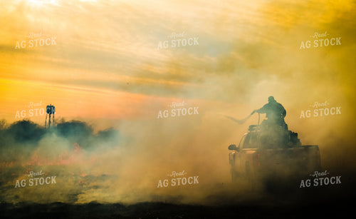 Firefighter Putting out Field Fire 214009