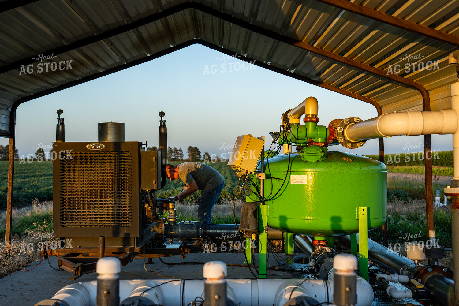 Farmer Working On Drip Irrigation System 65930