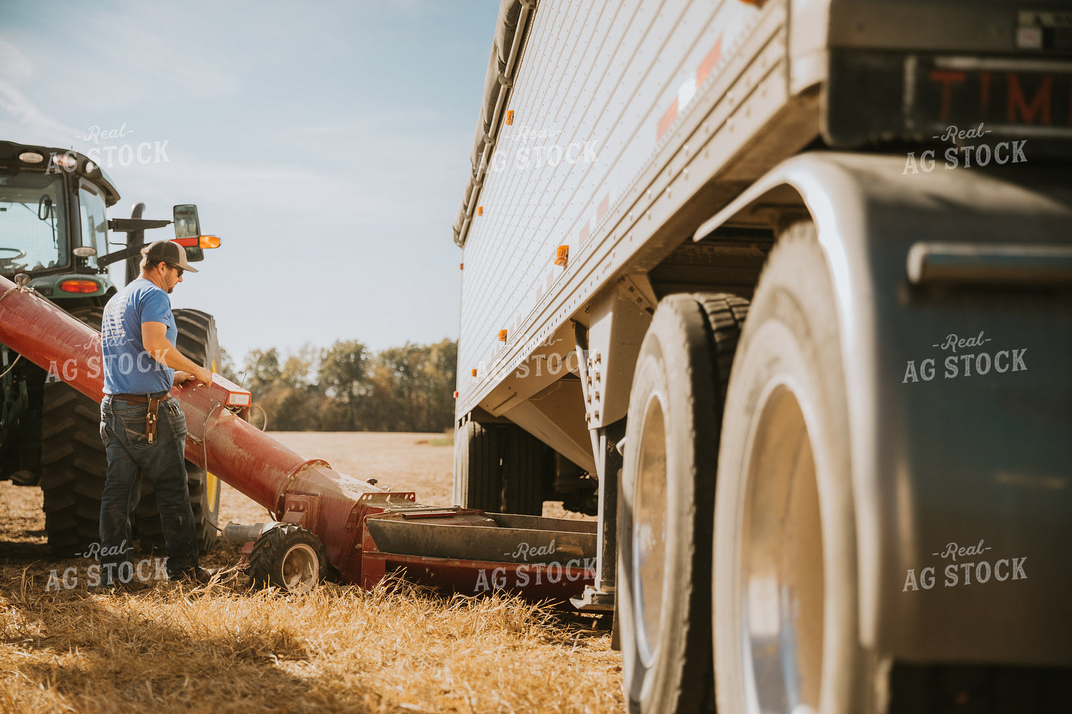 Farmer Setting Up Auger 7059