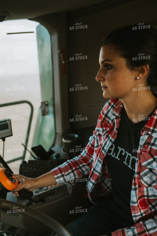 Female Farmer Driving Combine 3495