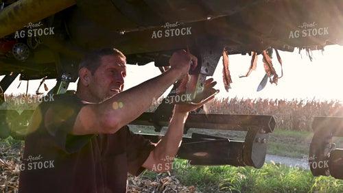 Farmer Collapsing Legs on Combine Head