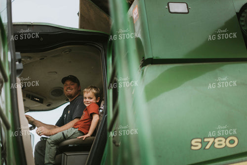 Farmer and Son in Tractor 8595