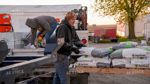 Farmers Loading Truck with Seed Bags 25190