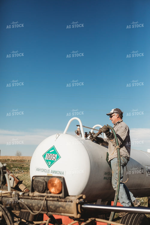 Farmer Hooking Up Anhydrous Ammonia Tank 3570