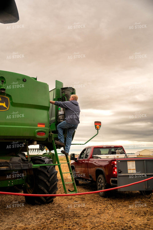 Farmer Fueling up Combine 115400