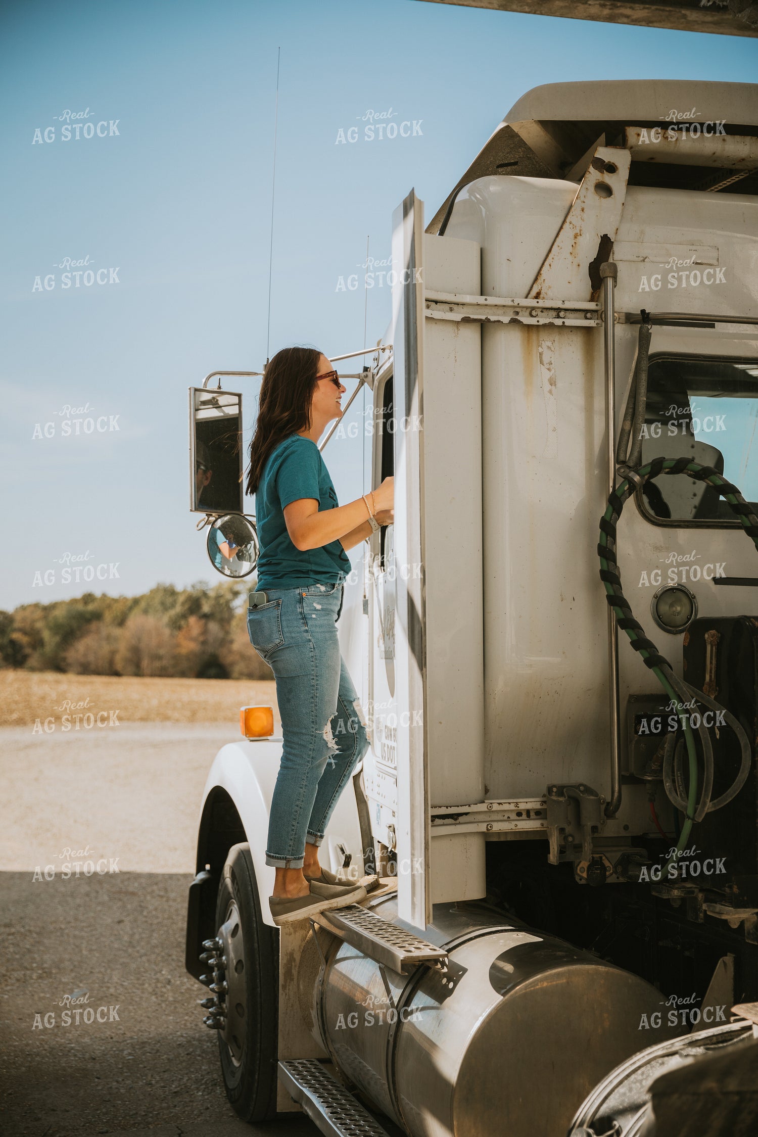 Female Farmer Getting in Semi Cab 7045