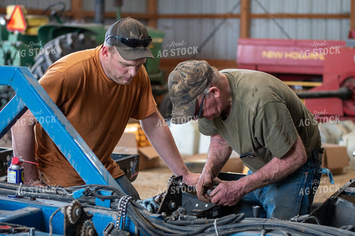 Farmers Working in Shed 50271