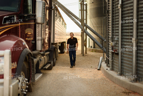 Farmer Dumping Corn 9431
