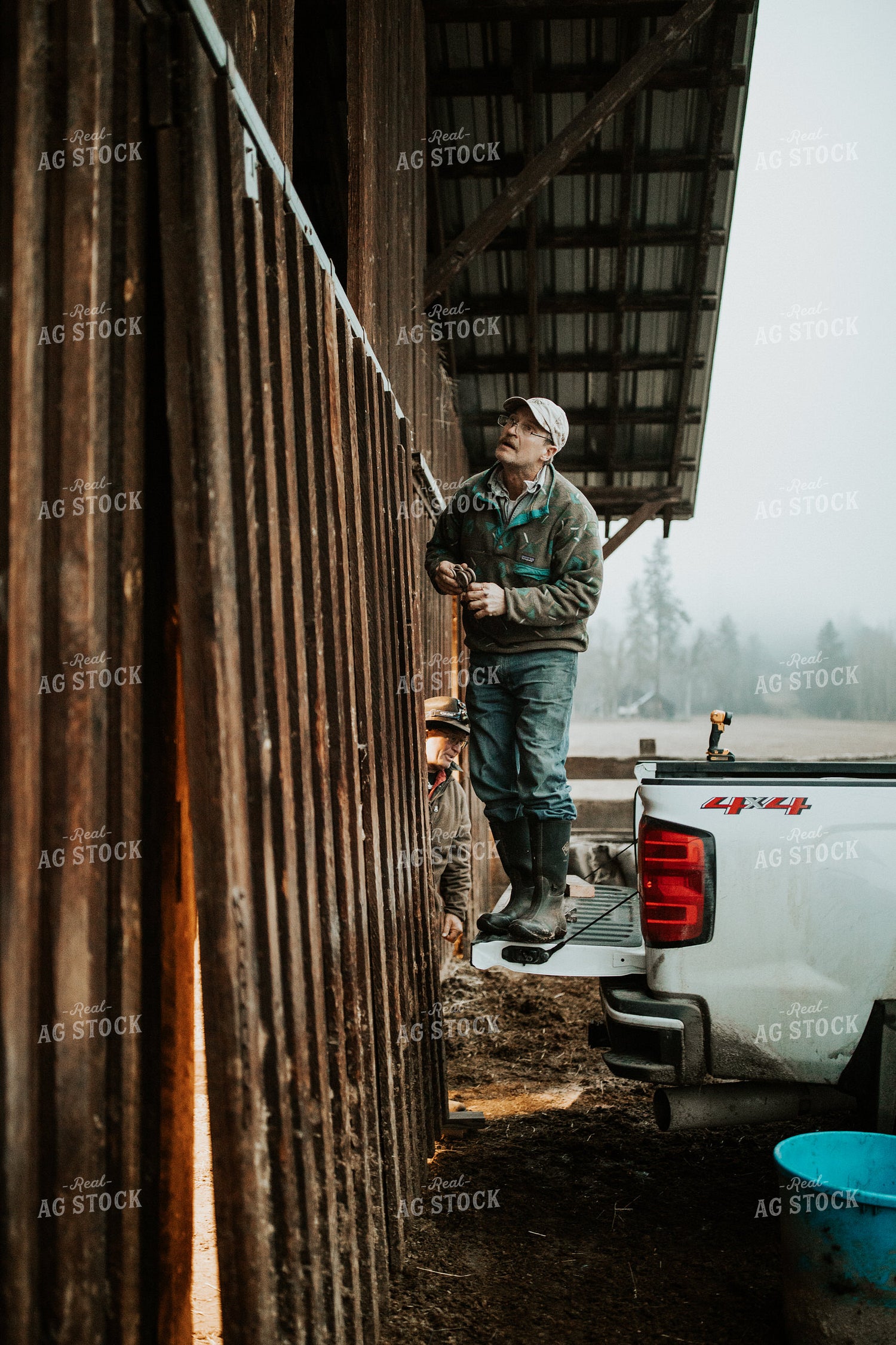 Ranchers Fixing Barn Door 66025