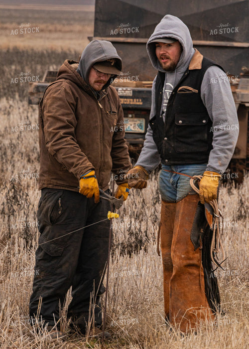 Ranchers Fixing Fence 231062