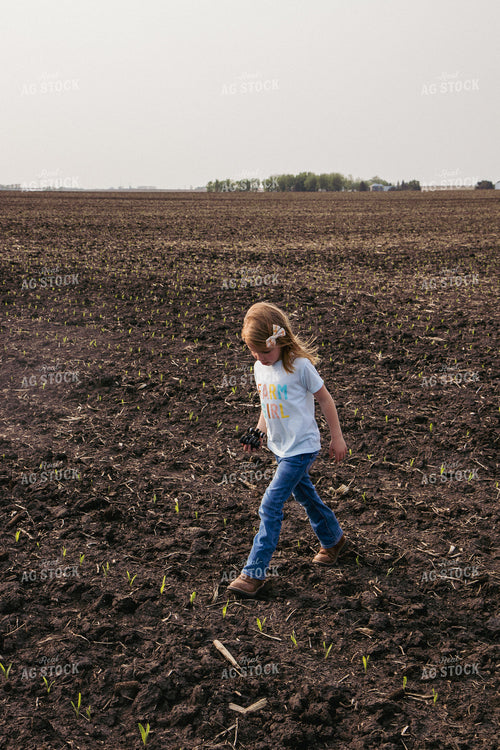 Farm Kid Walking in Emerging Corn Field 67293
