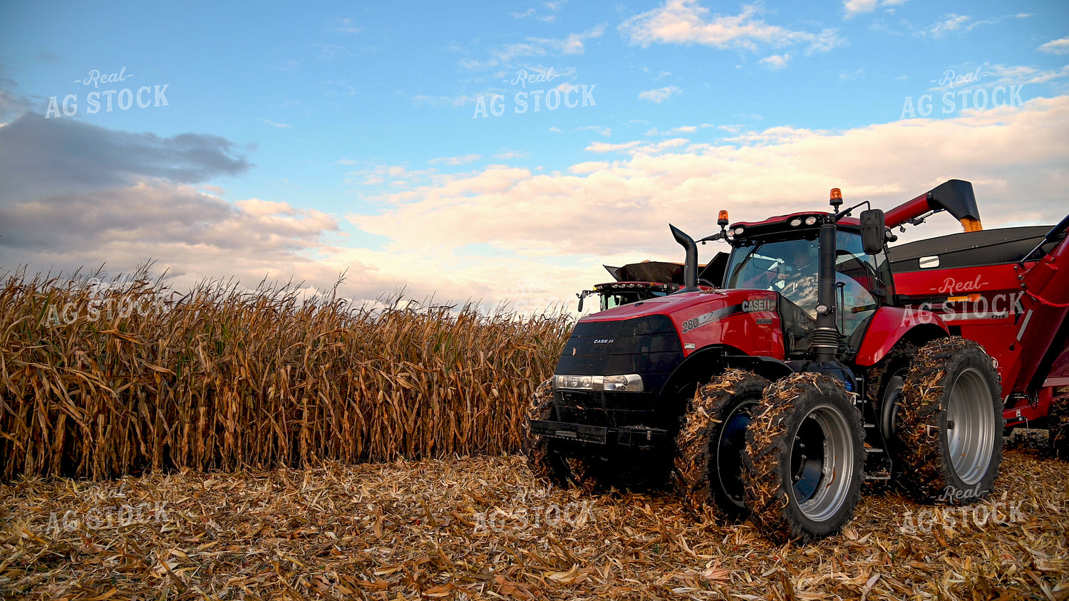 Combine Unloading Corn into Auger Wagon on the Go 25643