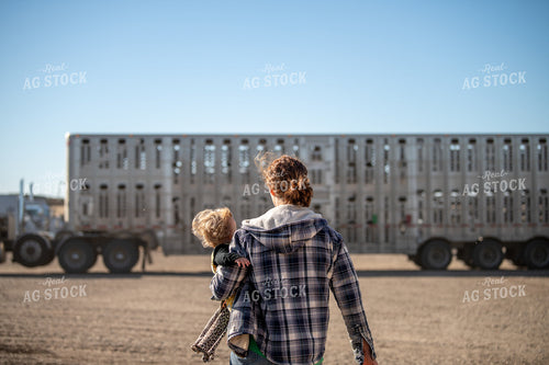 Female Rancher Walking with Farm Kids 212086