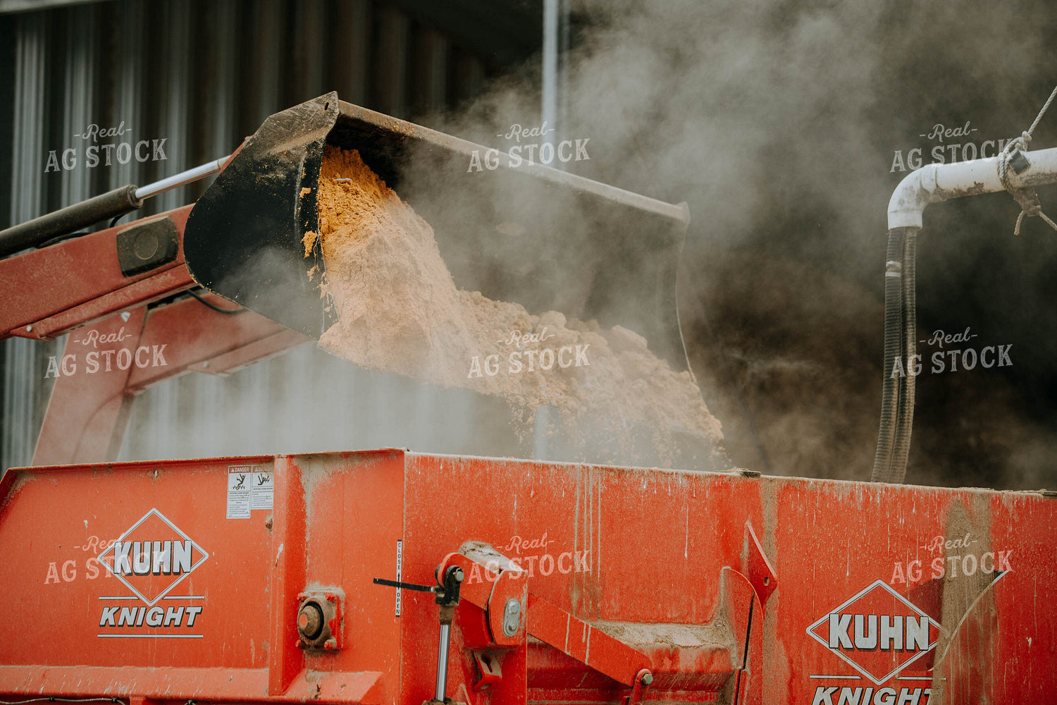 Tractor Emptying into feed mixer 77145