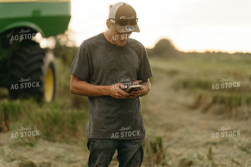 Farmer Using Phone in Rice Field 125266