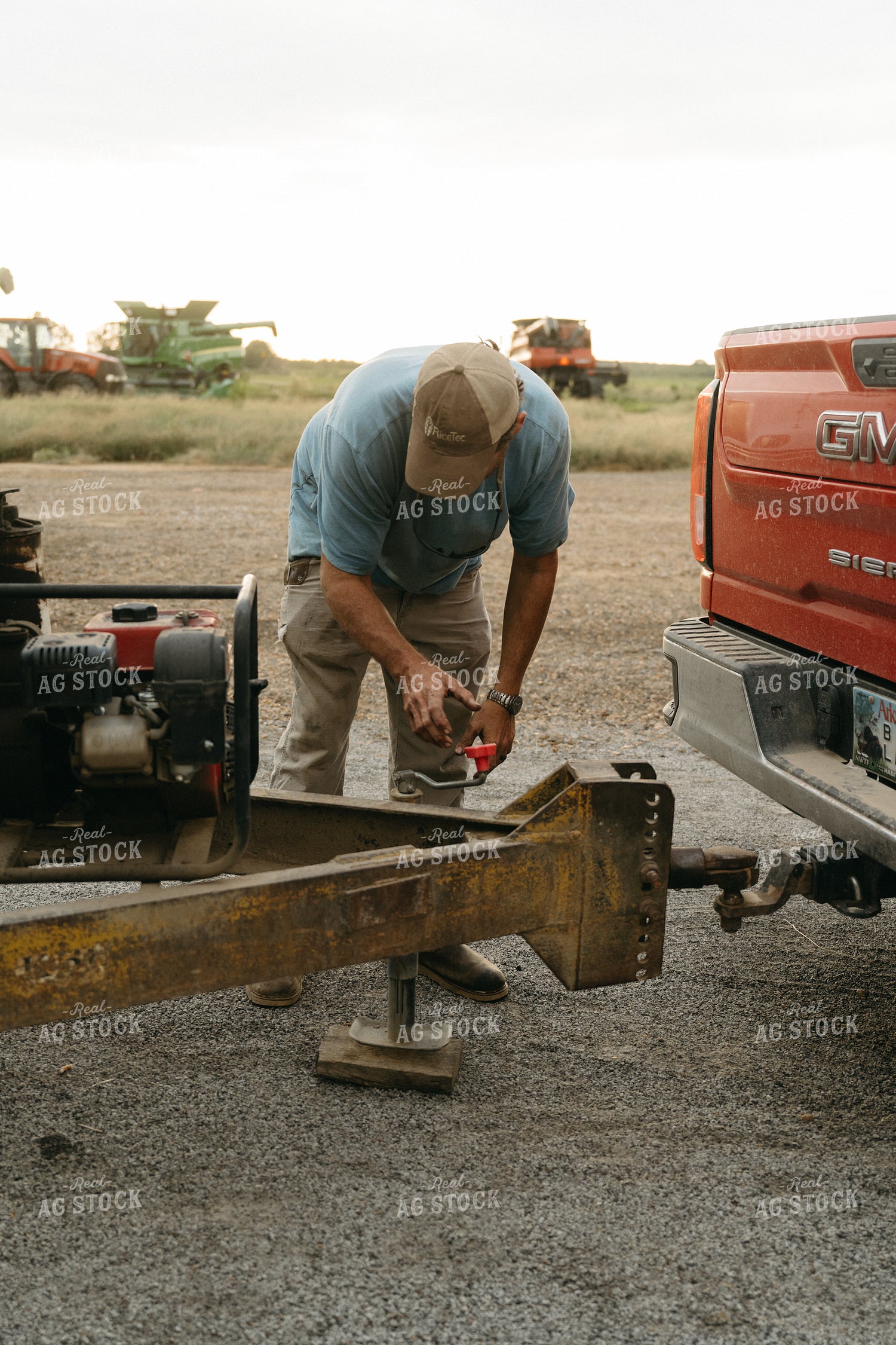 Farmer Hooking Up Trailer 125271