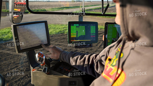 Farmer in the Tractor Cab with Technology 25184