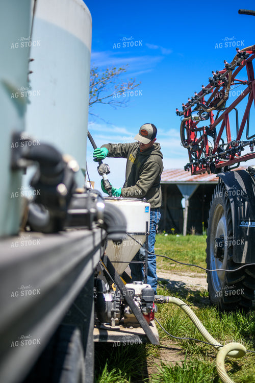 Farmer Mixing Chemicals for Self Propelled Sprayer 191069