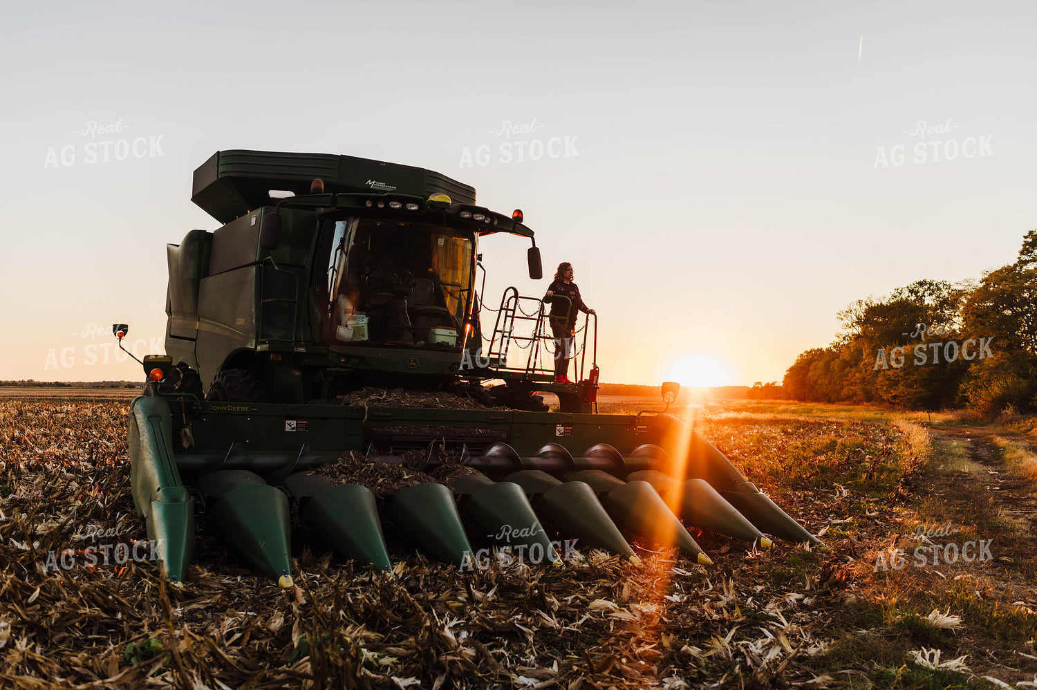 Farmer Climbing into Tractor 115137