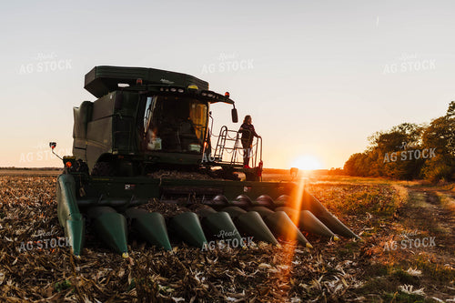 Farmer Climbing into Tractor 115137