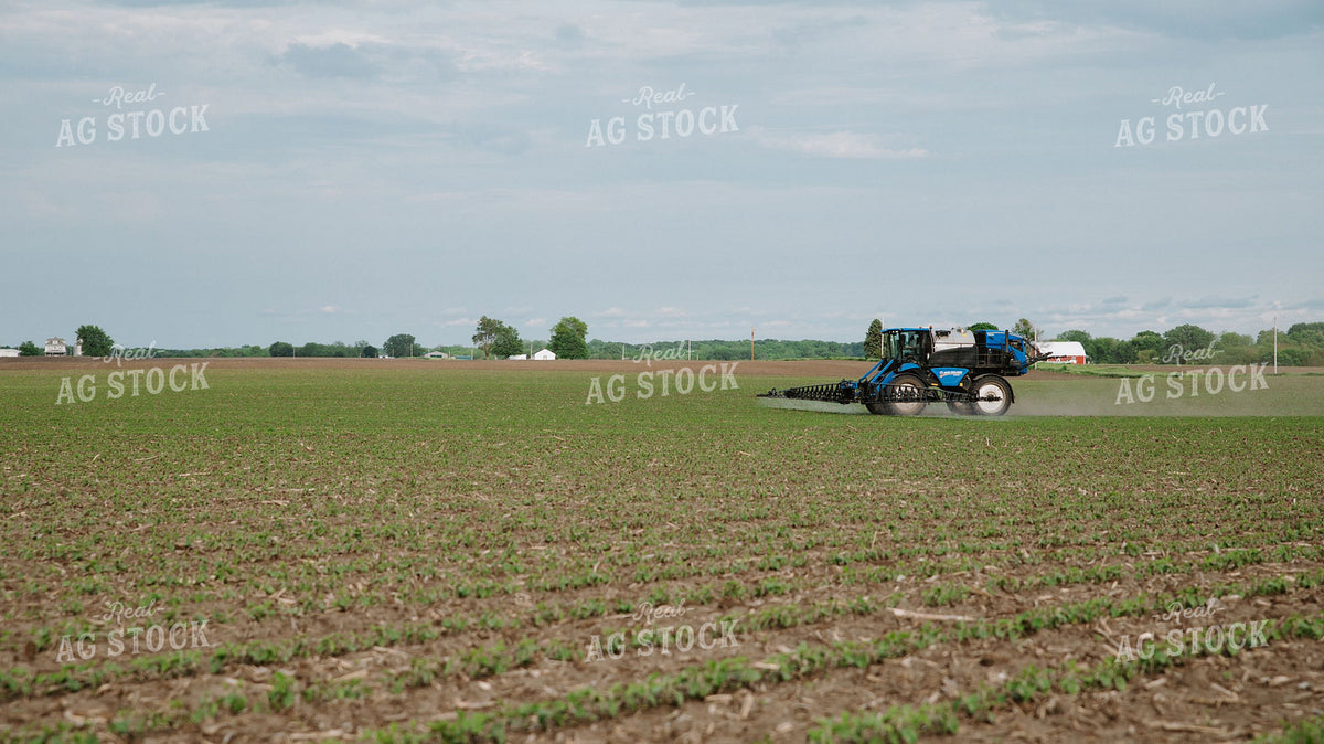 Self-Propelled Sprayer Applying Crop Protection on Early-Season Field 401010