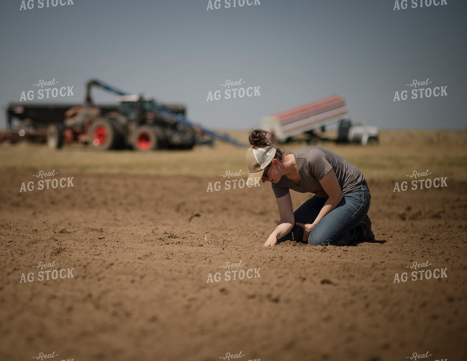 Female Farmer Checking Seed Depth 135075