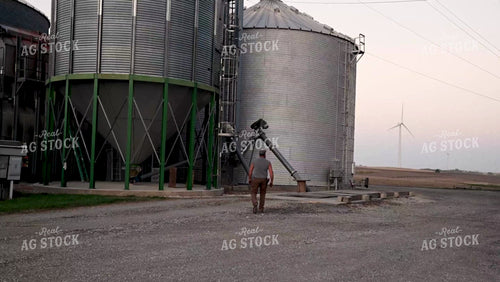 Farmer Working at Grain Bin Site during Harvest - 530