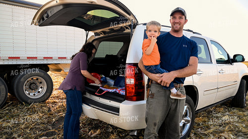Father and Son Enjoying Harvest Meal in the Field 25774