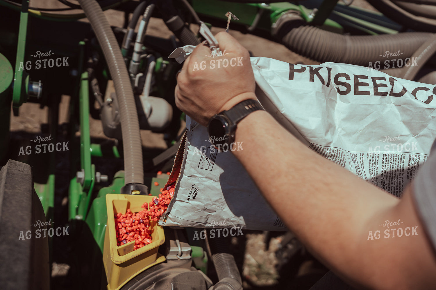 Farmer Filling Planter for Test Plot 196111