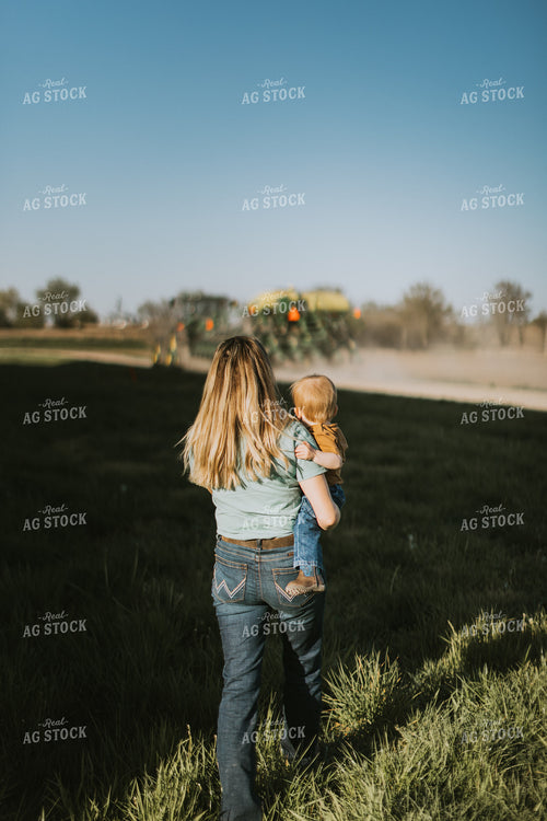 Farm Wife and Child Approach Tractor During Planting 7639