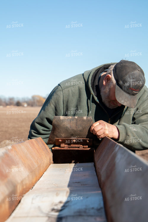 Farmer Working on Screening Machine 157278