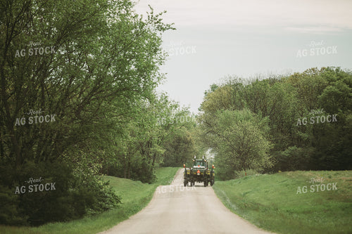 Tractor and Planter Driving Down Road 4014