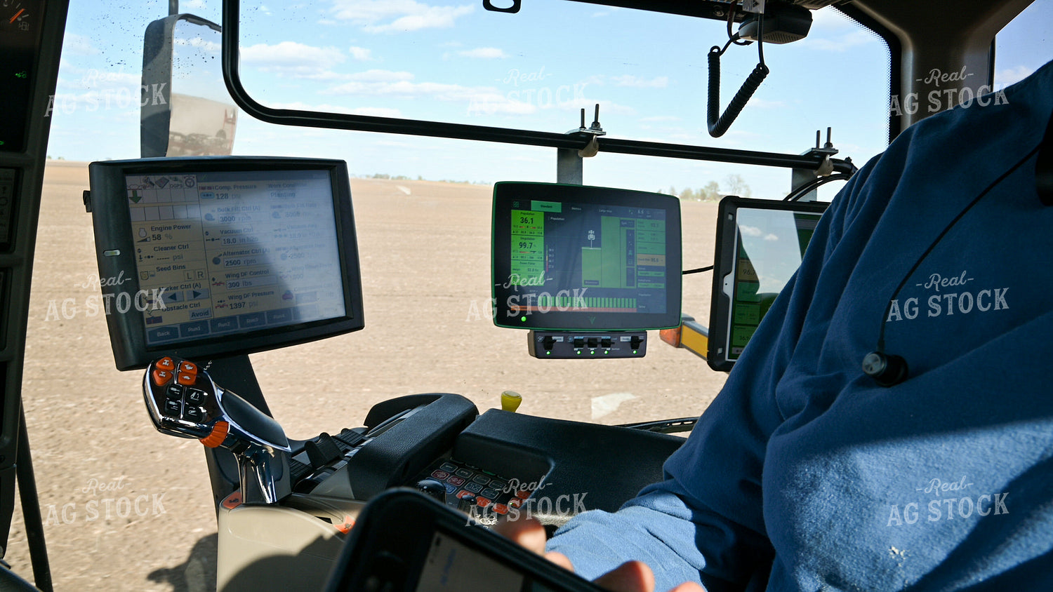 Farmer in the Tractor Cab with Technology 25219