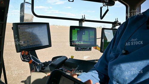 Farmer in the Tractor Cab with Technology 25219