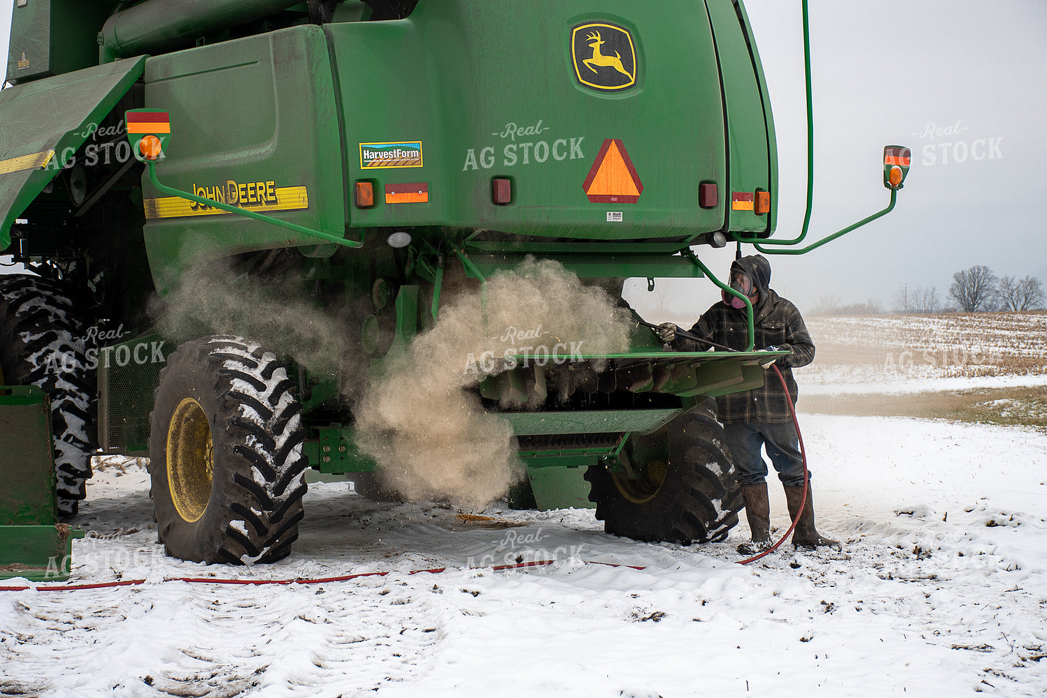Farmer Cleaning Combine 50463