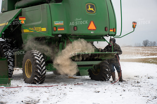 Farmer Cleaning Combine 50463