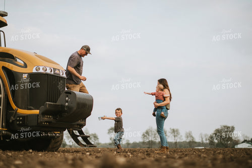 Farm Mom Taking Kids Out to Tractor During Planting 5640