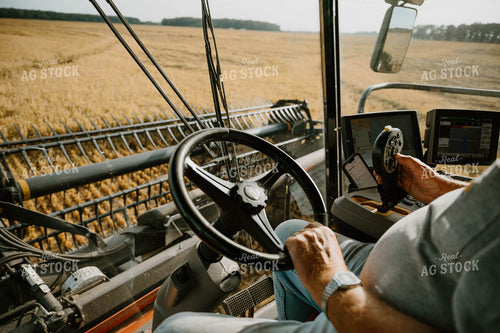 Farmer Operating Combine 125184