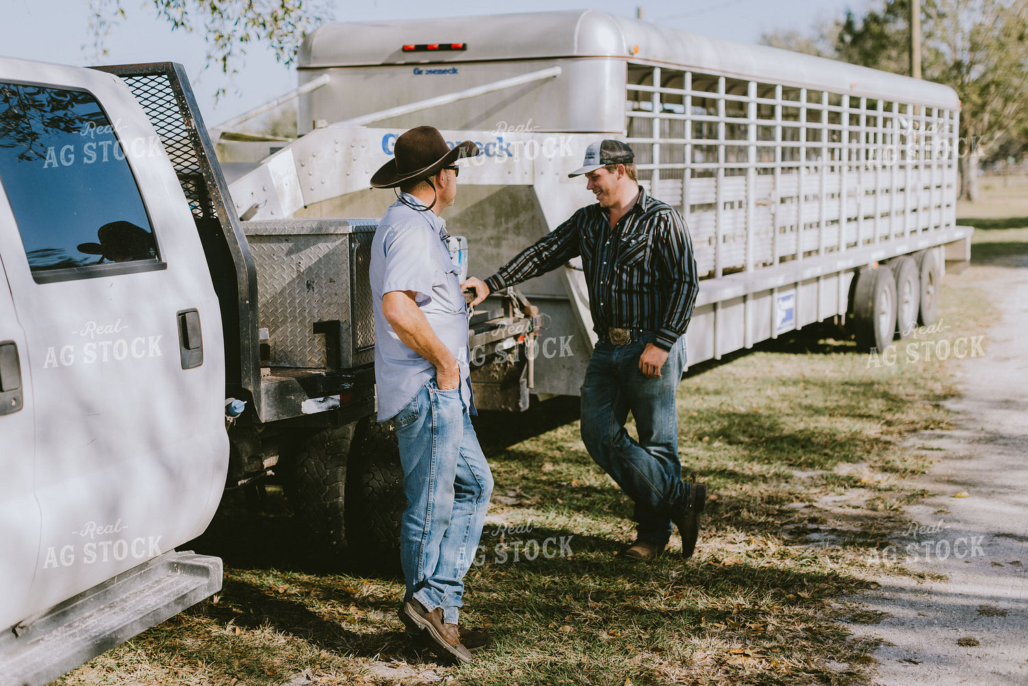Ranchers Talking By Trailer 7317