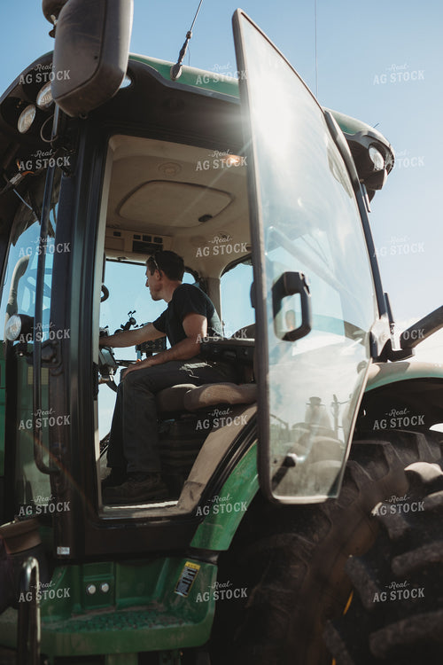 Farmer Adjusting Planter Monitor 4117