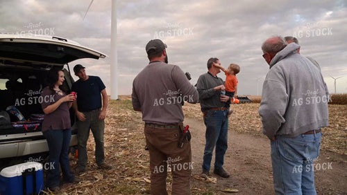 Family Enjoying Harvest Meal in the Field - 549