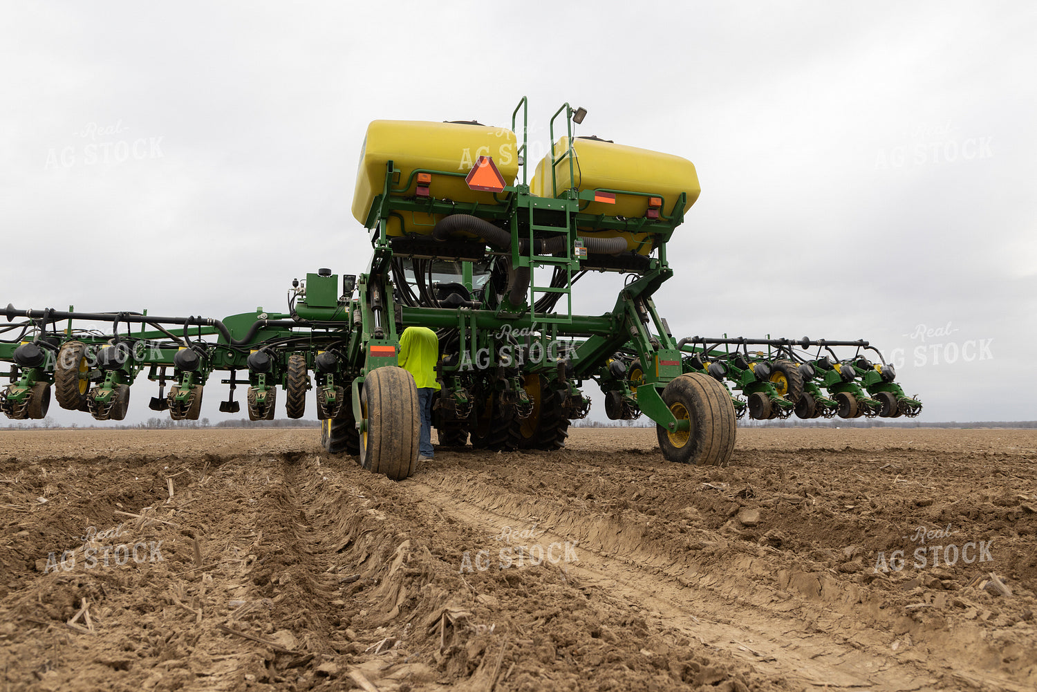 Farmer Fixes Planter 79776