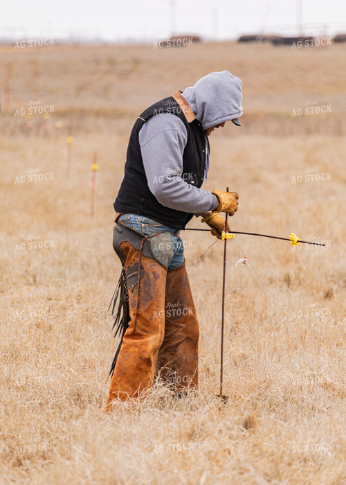 Rancher Fixing Fence 231072