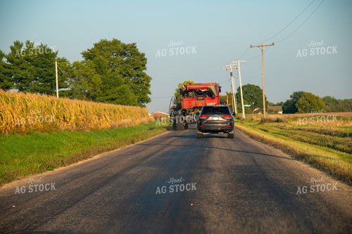 Combine Driving Down Road 25444