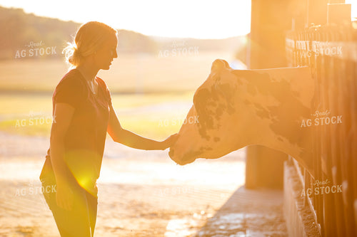 Female Farmer with Holstein Cow 55359